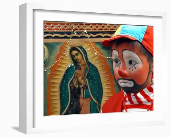 Young Clown, "Bolillito," Stands Next to an Image of the Virgin of Guadalupe in Mexico City-null-Framed Photographic Print