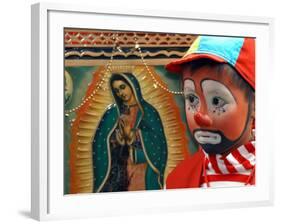 Young Clown, "Bolillito," Stands Next to an Image of the Virgin of Guadalupe in Mexico City-null-Framed Photographic Print