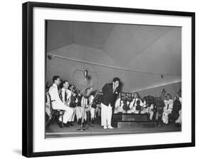 Young Conductor Lorin Maazel Taking a Bow at a Concert by the Robin Hood Dell Orchestra-Nina Leen-Framed Premium Photographic Print
