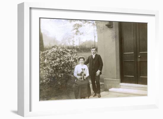 Young Couple and a Puppy in a Garden-null-Framed Photographic Print