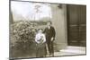 Young Couple and a Puppy in a Garden-null-Mounted Photographic Print