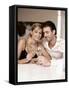 Young Couple Clinking Glasses of White Wine-Sporrer & Skowronek-Framed Stretched Canvas