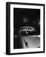 Young Couple Cuddling as They Watch a Movie at Drive in Theater-Francis Miller-Framed Premium Photographic Print