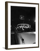 Young Couple Cuddling as They Watch a Movie at Drive in Theater-Francis Miller-Framed Photographic Print