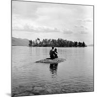 Young Couple Embracing on Small Rock Protruding from the Waters of Lake George-Nina Leen-Mounted Photographic Print