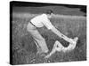 Young Couple Frolicking in Grass-Philip Gendreau-Stretched Canvas