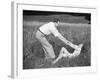 Young Couple Frolicking in Grass-Philip Gendreau-Framed Photographic Print