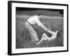 Young Couple Frolicking in Grass-Philip Gendreau-Framed Photographic Print