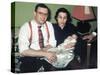 Young Couple Holding Baby Boy in Christening Gown, Ca. 1952-null-Stretched Canvas
