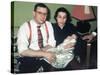 Young Couple Holding Baby Boy in Christening Gown, Ca. 1952-null-Stretched Canvas