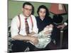 Young Couple Holding Baby Boy in Christening Gown, Ca. 1952-null-Mounted Premium Photographic Print