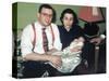 Young Couple Holding Baby Boy in Christening Gown, Ca. 1952-null-Stretched Canvas