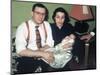 Young Couple Holding Baby Boy in Christening Gown, Ca. 1952-null-Mounted Photographic Print
