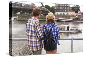 Young Couple on a Journey to Europe, Standing on the Bank of the Vistula, Rear View.-De Visu-Stretched Canvas