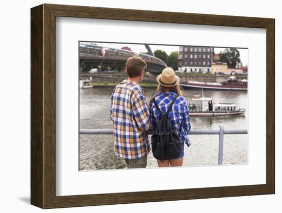 Young Couple on a Journey to Europe, Standing on the Bank of the Vistula, Rear View.-De Visu-Framed Photographic Print