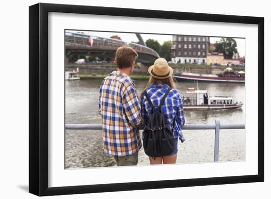 Young Couple on a Journey to Europe, Standing on the Bank of the Vistula, Rear View.-De Visu-Framed Photographic Print