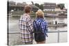Young Couple on the River Bank in a European City (Rear View) Romantic Journey.-De Visu-Stretched Canvas