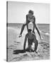 Young Couple Playing Leapfrog on the Beach-The Chelsea Collection-Stretched Canvas