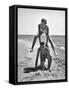 Young Couple Playing Leapfrog on the Beach-The Chelsea Collection-Framed Stretched Canvas