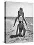 Young Couple Playing Leapfrog on the Beach-The Chelsea Collection-Stretched Canvas