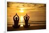 Young Couple Practicing Yoga On The Sea Beach At Sunset-De Visu-Framed Art Print