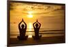 Young Couple Practicing Yoga On The Sea Beach At Sunset-De Visu-Framed Art Print