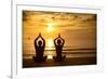 Young Couple Practicing Yoga On The Sea Beach At Sunset-De Visu-Framed Art Print