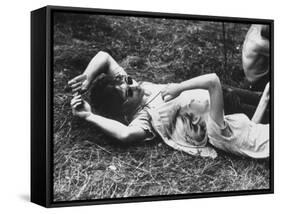 Young Couple Relaxing During Woodstock Music Festival-Bill Eppridge-Framed Stretched Canvas