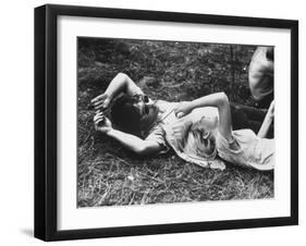 Young Couple Relaxing During Woodstock Music Festival-Bill Eppridge-Framed Photographic Print