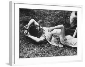 Young Couple Relaxing During Woodstock Music Festival-Bill Eppridge-Framed Photographic Print