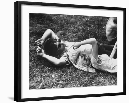 Young Couple Relaxing During Woodstock Music Festival-Bill Eppridge-Framed Photographic Print