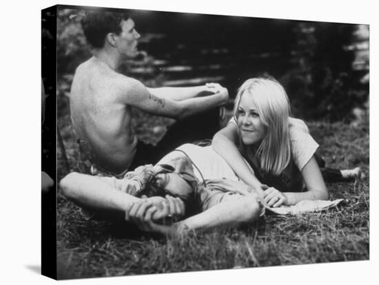 Young Couple Relaxing During Woodstock Music Festival-null-Stretched Canvas