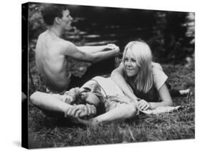 Young Couple Relaxing During Woodstock Music Festival-null-Stretched Canvas