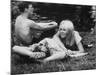 Young Couple Relaxing During Woodstock Music Festival-null-Mounted Photographic Print