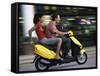 Young Couple Riding on a Motor Scooter-null-Framed Stretched Canvas