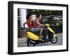 Young Couple Riding on a Motor Scooter-null-Framed Premium Photographic Print