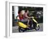 Young Couple Riding on a Motor Scooter-null-Framed Premium Photographic Print