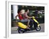 Young Couple Riding on a Motor Scooter-null-Framed Photographic Print