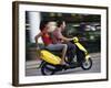 Young Couple Riding on a Motor Scooter-null-Framed Photographic Print