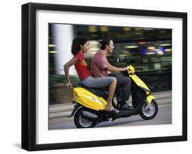 Young Couple Riding on a Motor Scooter-null-Framed Photographic Print