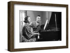 Young Couple Seated at Piano-Philip Gendreau-Framed Photographic Print