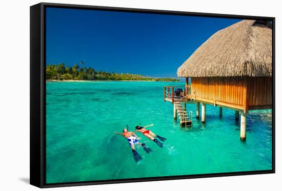 Young Couple Snorkeling from Hut over Blue Tropical Lagoon-Martin Valigursky-Framed Stretched Canvas