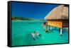 Young Couple Snorkeling from Hut over Blue Tropical Lagoon-Martin Valigursky-Framed Stretched Canvas