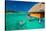 Young Couple Snorkeling from Hut over Blue Tropical Lagoon-Martin Valigursky-Stretched Canvas