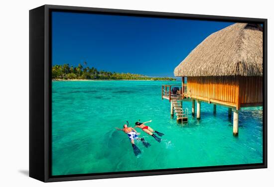 Young Couple Snorkeling from Hut over Blue Tropical Lagoon-Martin Valigursky-Framed Stretched Canvas