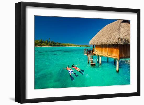 Young Couple Snorkeling from Hut over Blue Tropical Lagoon-Martin Valigursky-Framed Photographic Print