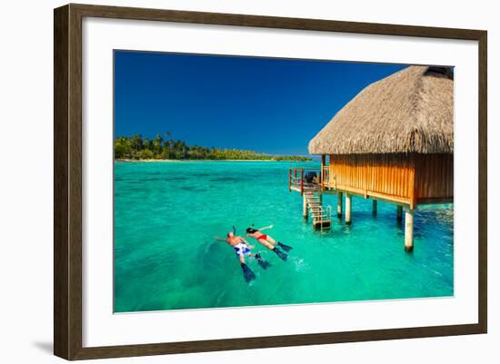 Young Couple Snorkeling from Hut over Blue Tropical Lagoon-Martin Valigursky-Framed Photographic Print