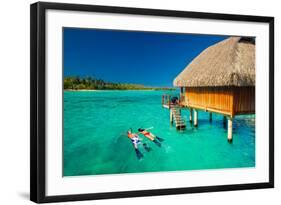 Young Couple Snorkeling from Hut over Blue Tropical Lagoon-Martin Valigursky-Framed Photographic Print