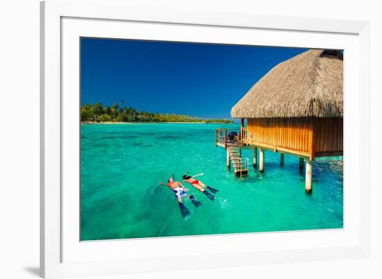 Young Couple Snorkeling from Hut over Blue Tropical Lagoon-Martin Valigursky-Framed Photographic Print