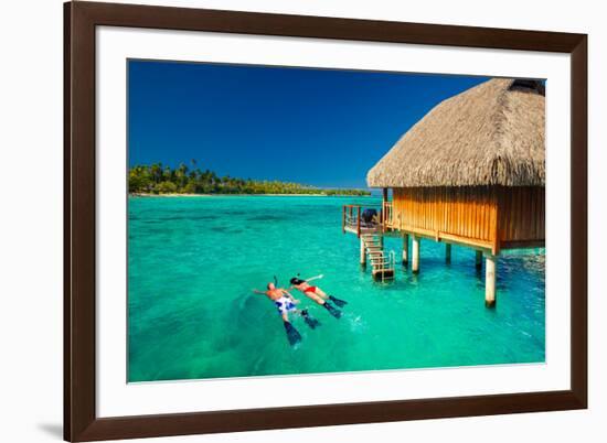 Young Couple Snorkeling from Hut over Blue Tropical Lagoon-Martin Valigursky-Framed Photographic Print